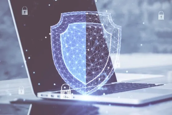 Laptop with glowing security shield